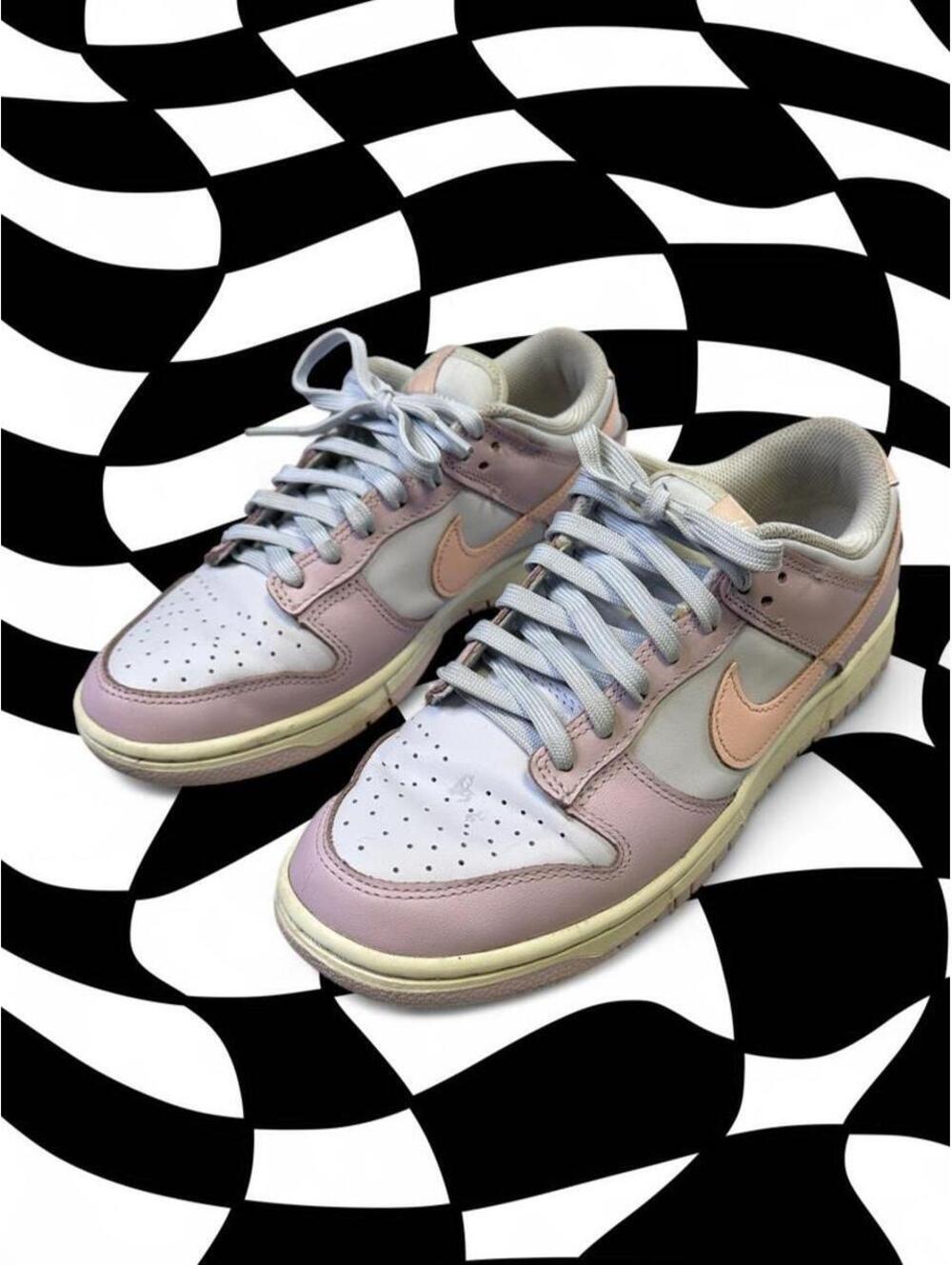 Nike Dunk Low Easter sneakers in pink, white, and peach with a Nike swoosh